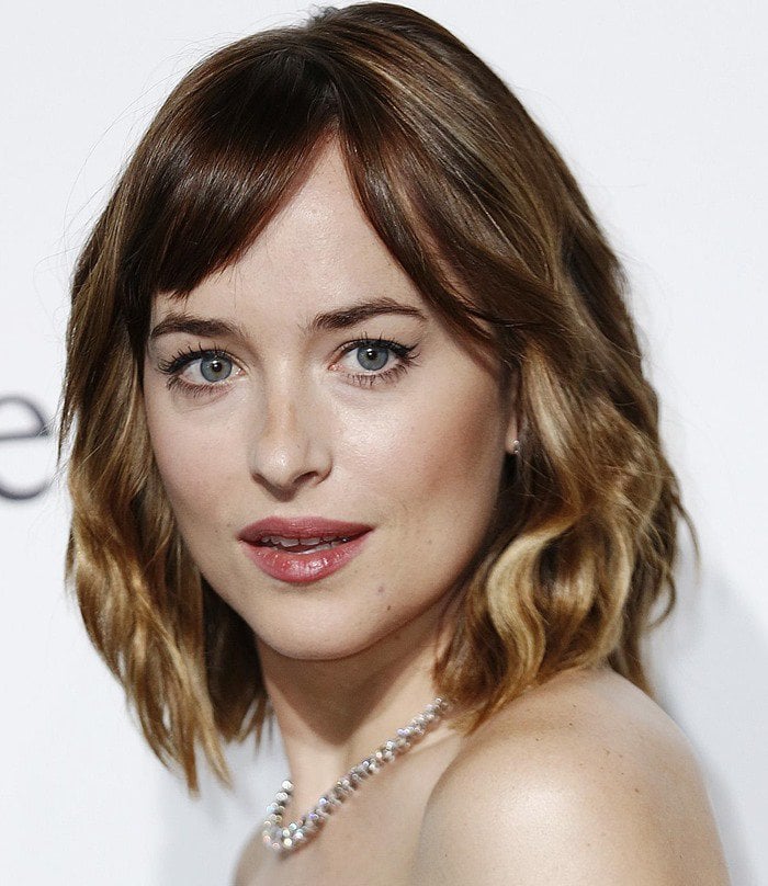 Dakota Johnson attends the 2015 amfAR Milano Gala