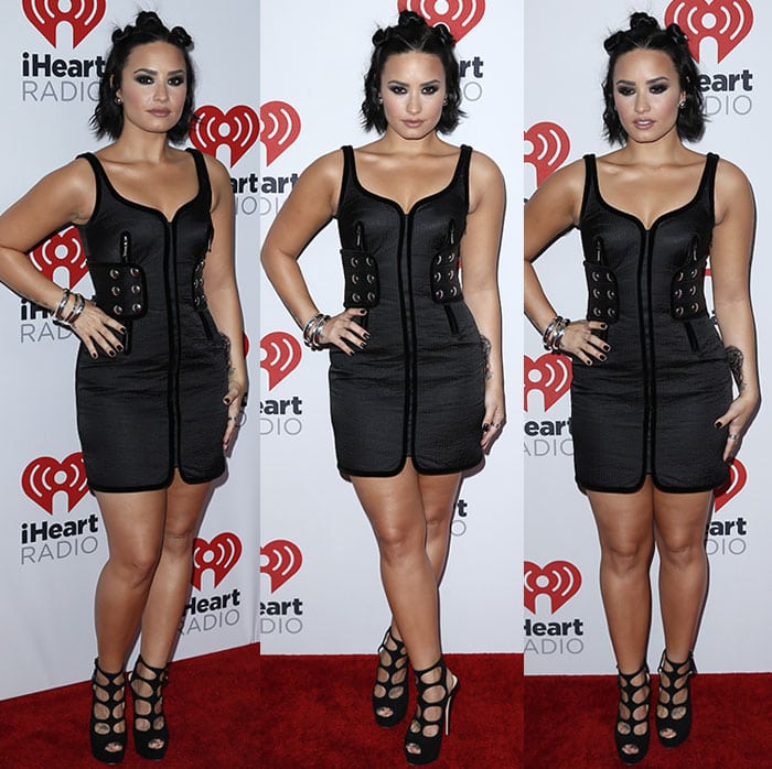 Demi Lovato flirts with the camera on the red carpet