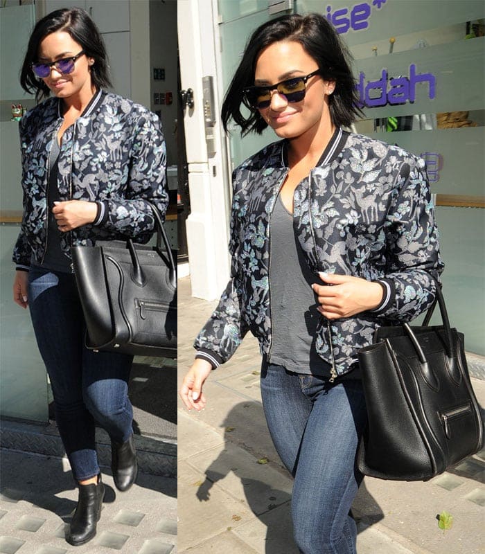 Demi Lovato exudes casual chic in a deer-printed bomber jacket, leaving a London office, September 10, 2015