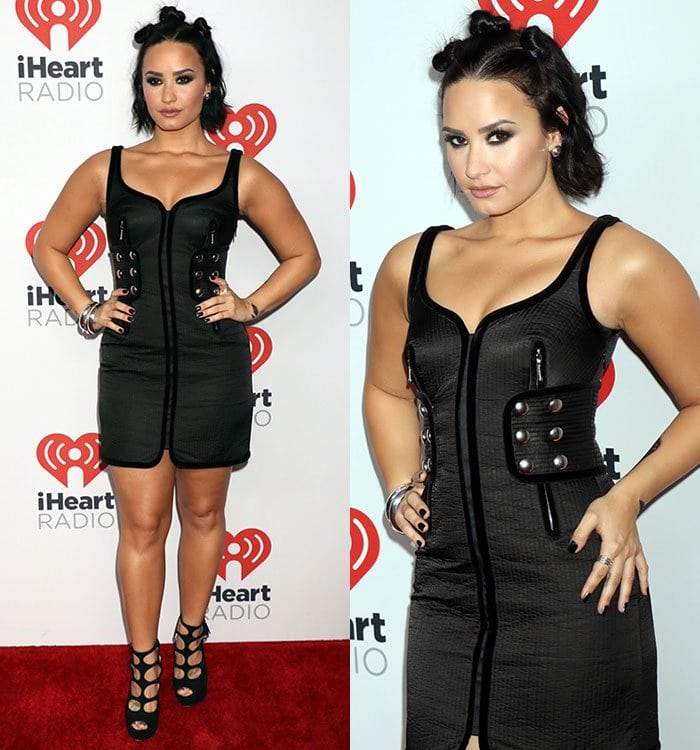 Demi Lovato poses with her hands on her hips at the iHeartRadio Music Festival