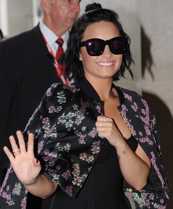 Radiant in London: Demi Lovato in a Dries Van Noten cropped jacket at BBC Radio 1 studios, September 9, 2015, showcasing floral elegance