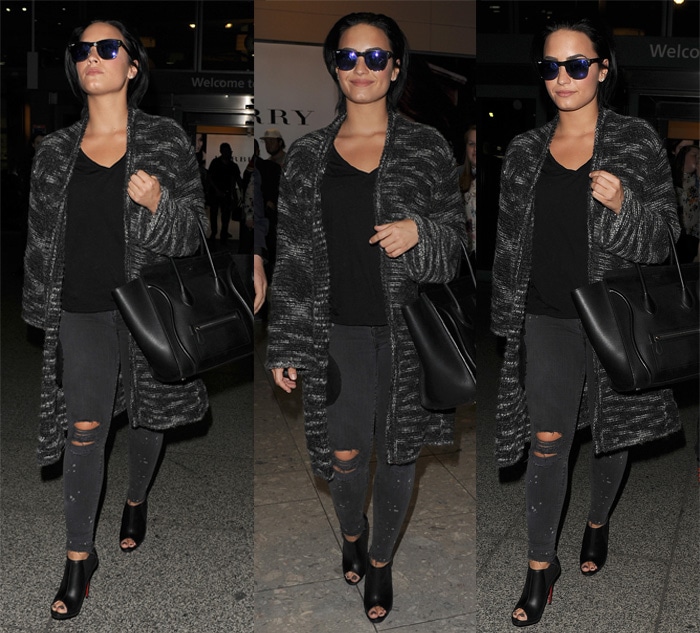 Demi Lovato, stylishly cozy in a Zadig & Voltaire coat, spotted at Heathrow Airport, London, September 7, 2015 – epitome of travel chic