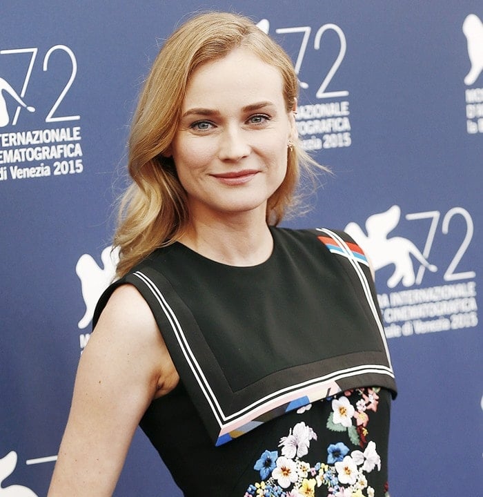 Diane Kruger smiles in a sleeveless dress with a nautical-inspired panel at the yoke and floral threadwork embroidery