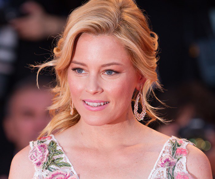 Elizabeth Banks matches her pale pink lipstick to her Marchesa gown at the 2015 Venice Film Festival