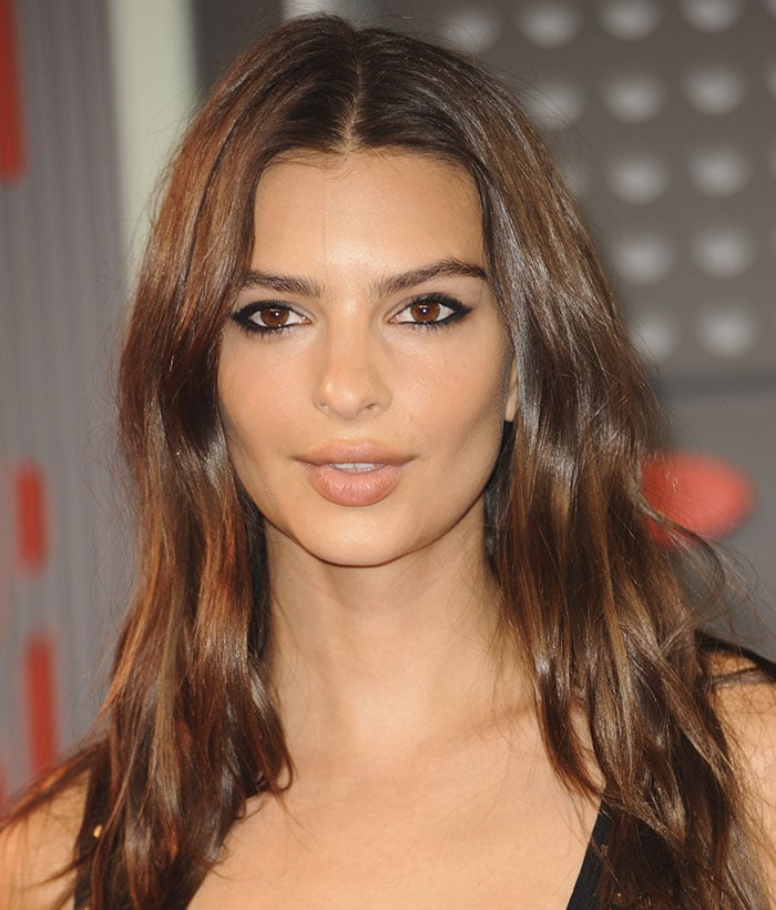 Emily Ratajkowski lets her soft brown hair fall in messy waves around her shoulders