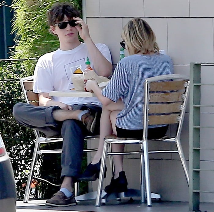 Evan Peters and his girlfriend Emma Roberts eating lunch in Los Angeles on August 10, 2012