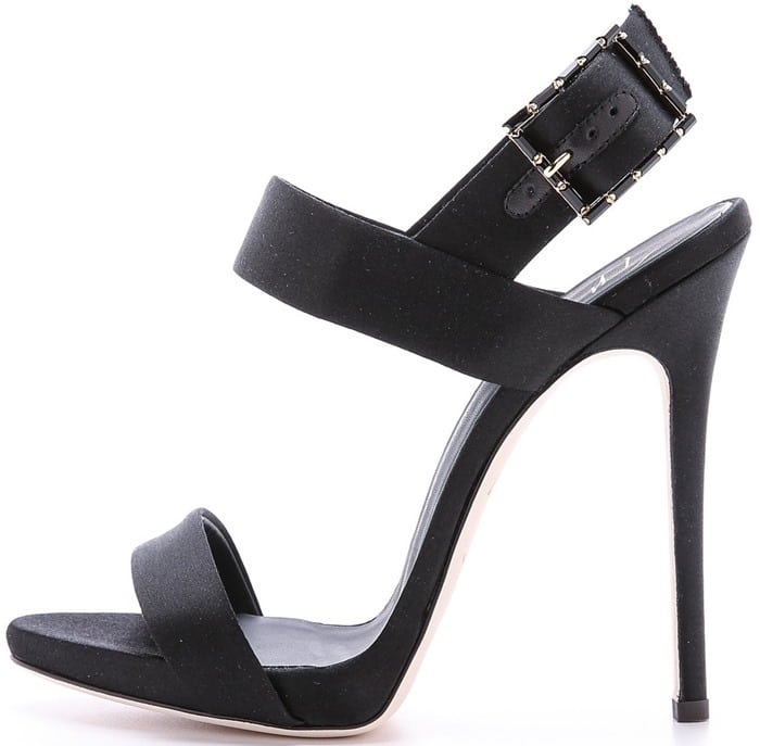 A sparkling, crystal-trimmed buckle gives these satin Giuseppe Zanotti sandals a pop of gothic glamour