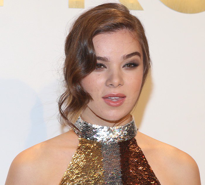 Hailee Steinfeld curls her dark hair at the Michael Kors Gold Collection Fragrance Launch held during 2015 New York Fashion Week