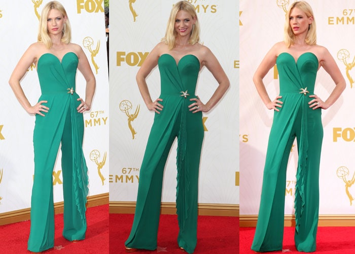 January Jones wears an emerald green Ulyana Sergeenko jumpsuit on the red carpet of the Emmys