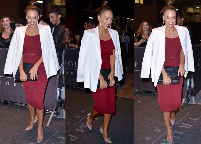 Jessica Alba wears a white blazer over top of a red Kempner dress