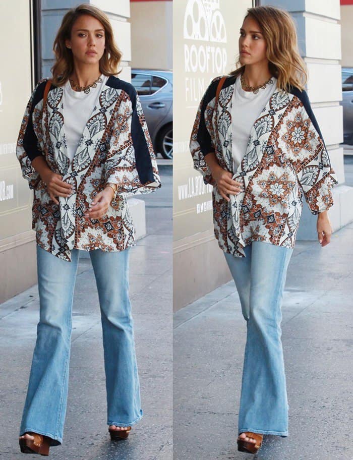 Jessica Alba nailed her casual look with a simple pairing of blue bell-bottom jeans and a white shirt