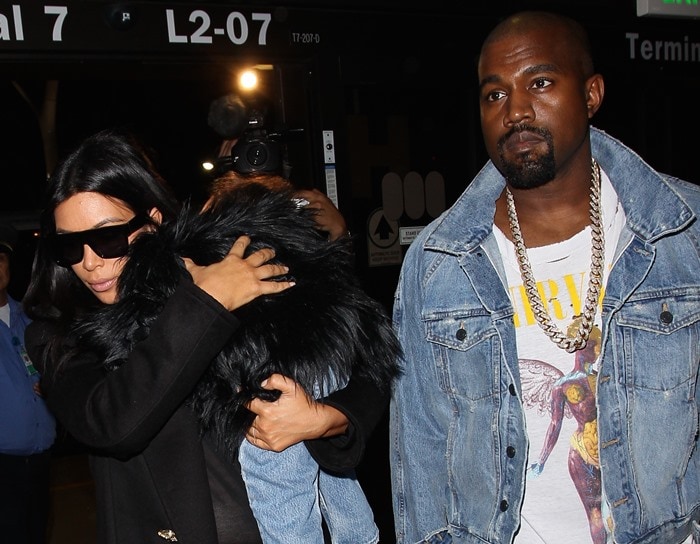 Kim Kardashian, Kanye West, and North West enter Los Angeles International Airport