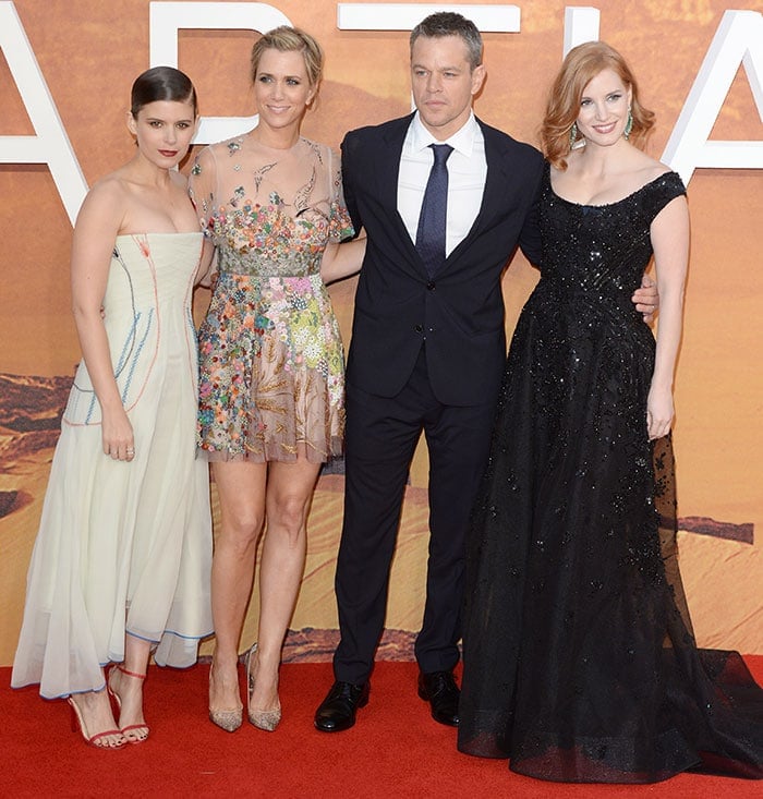 Kate Mara, Kristen Wiig, Matt Damon and Jessica Chastain pose on the red carpet of the premiere of "The Martian"