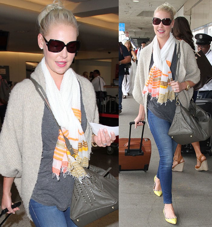 Katherine Heigl hides her eyes behind a large pair of sunglasses as she strolls through LAX