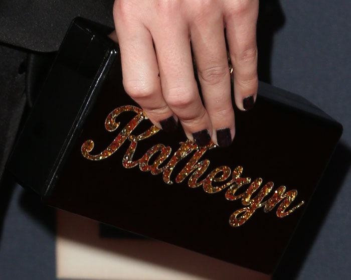 Katy Perry matches her manicure to her black Eddie Parker clutch
