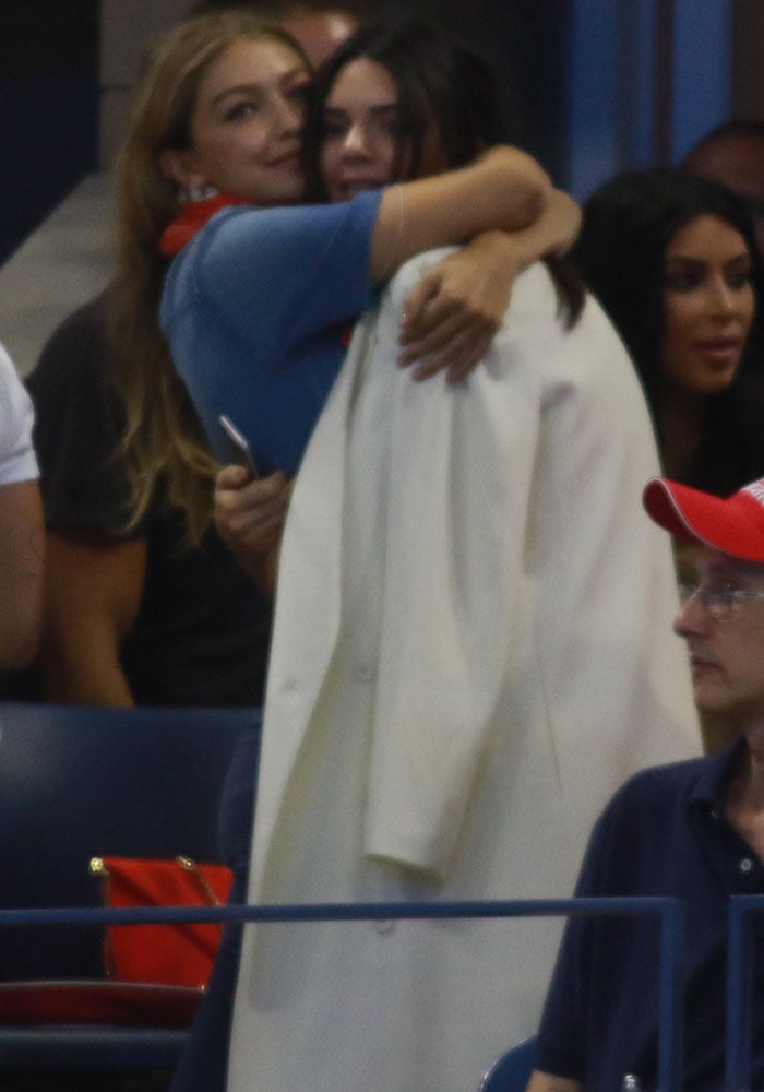 Kendall Jenner and Gigi Hadid mess around during a tennis match between Venus Williams and Serena Williams