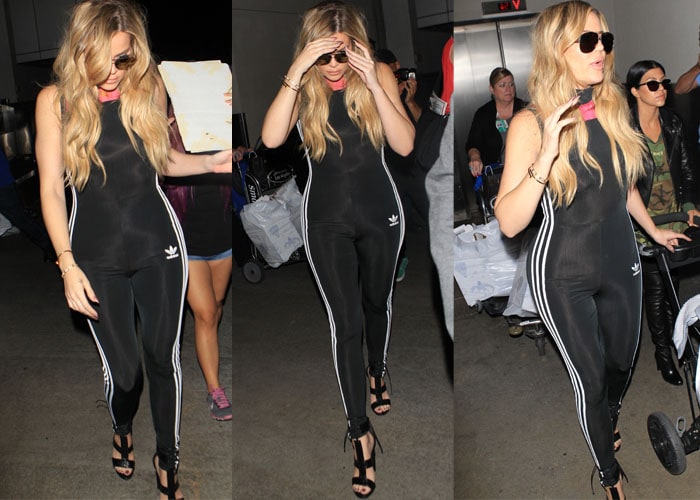 Khloé Kardashian strolls through LAC in a form-fitting Adidas tracksuit paired with heels