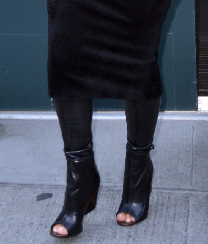 Kim Kardashian's toes peek out of her thigh-high leather Givenchy boots