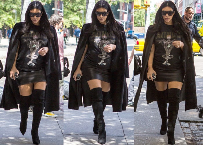 Kim Kardashian ignores the paparazzi as she heads to a lunch date wearing a Metallica tee and thigh-high boots