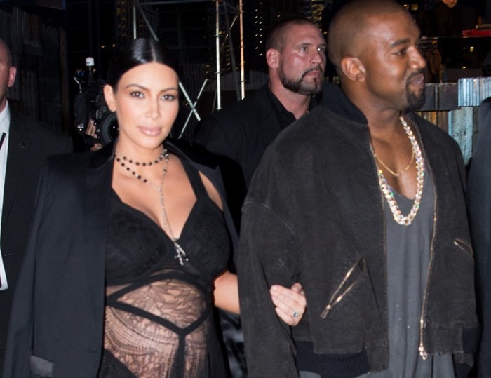 Kim Kardashian did not leave much to the imagination in a transparent lace dress that exposed her baby bump to the world and flashed portions of her thighs