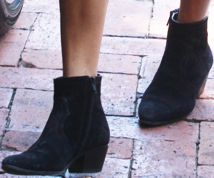 Kourtney Kardashian rocks suede cowboy boots from Saint Laurent