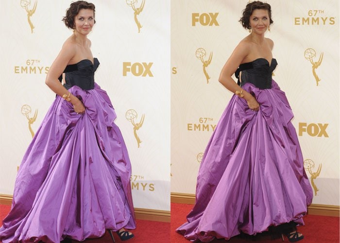 Maggie Gyllenhaal poses in front of a backdrop while wearing a stunning Oscar de la Renta dress