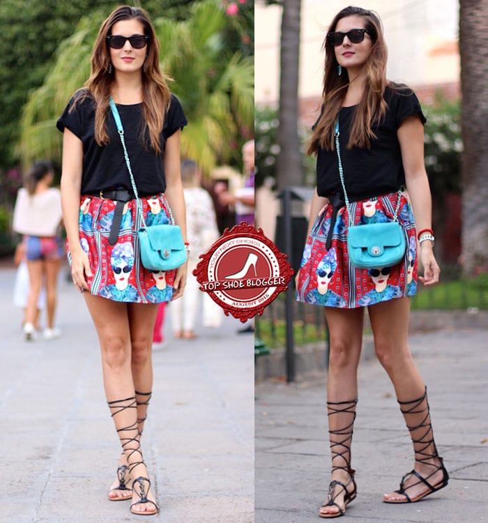 Marianela in a statement skirt, a simple black tee, and strappy gladiator sandals