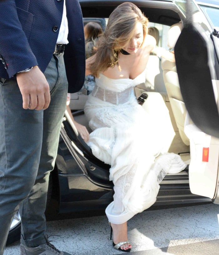 Miranda Kerr wears a pair of glittering sandals as she steps out of a car