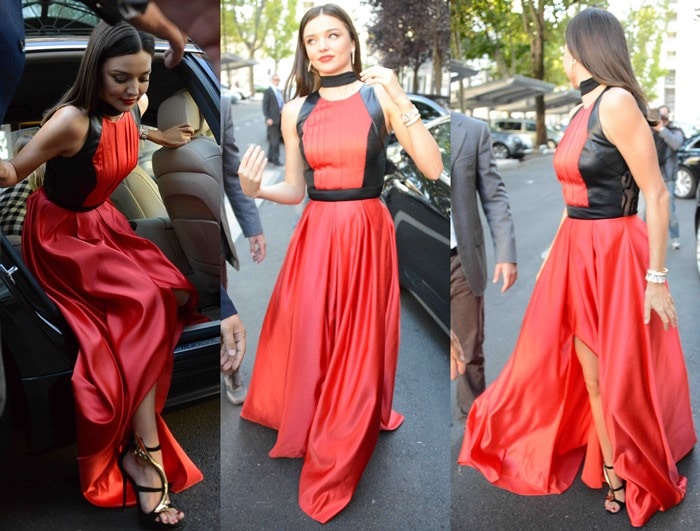 Miranda Kerr wears a red-and-black gown during Milan Fashion Week