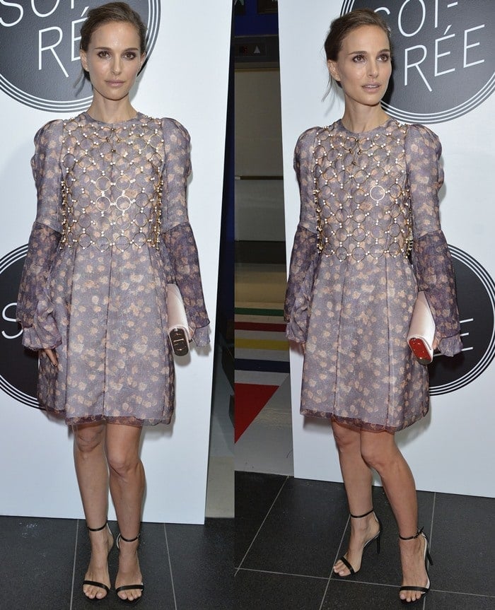 Natalie Portman poses in front of a backdrop wearing a lilac dress from Christian Dior