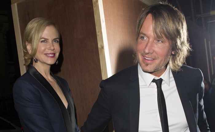 Nicole Kidman and Keith Urban both wear suit jackets as they arrive at the "Photograph 51" press night