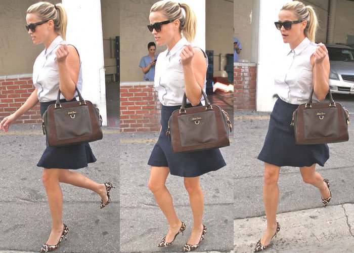 Reese Witherspoon runs errands in a collared top and a navy blue skirt