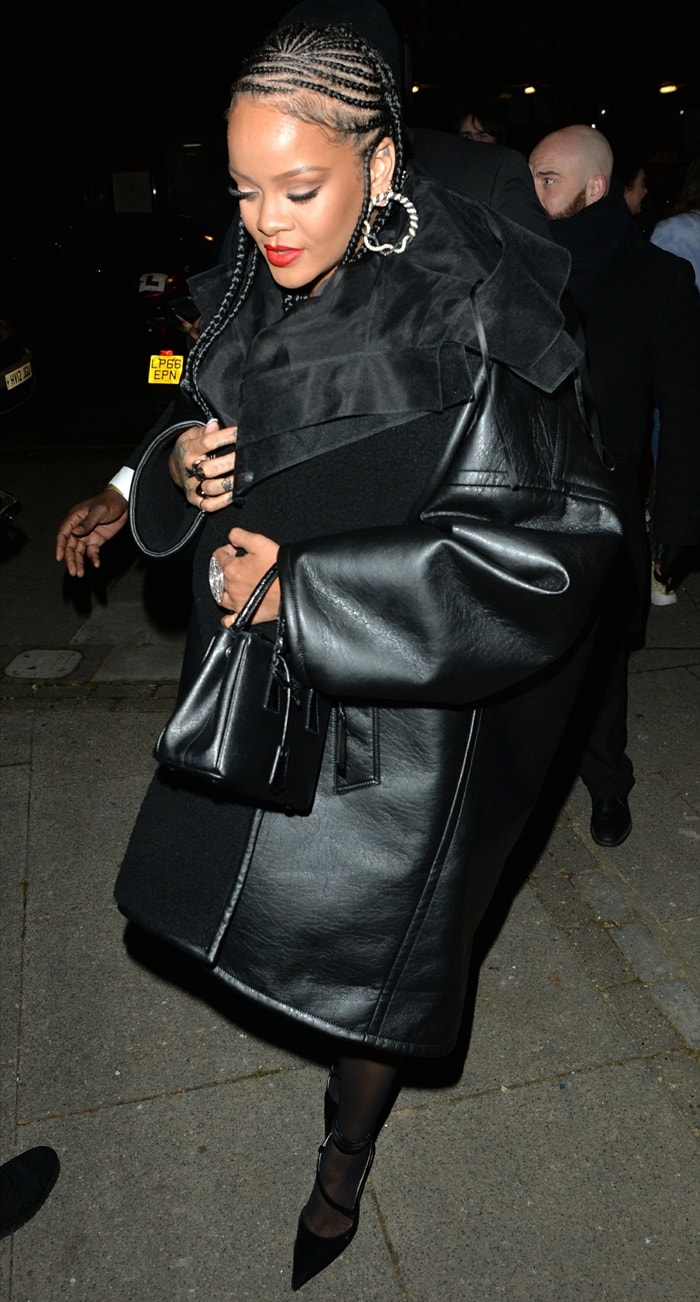 Rihanna's oversized belted faux shearling-trimmed faux leather coat from Balenciaga and De Grisogono x Emmanuel Tarpin diamond earrings