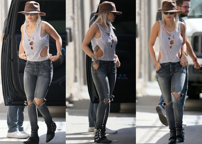 Rita Ora pairs a beaded cutout top with ripped jeans as she heads into ABC Studios for a performance