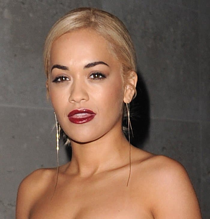 Rita Ora with long earrings leaving the Radio 1 studios in London