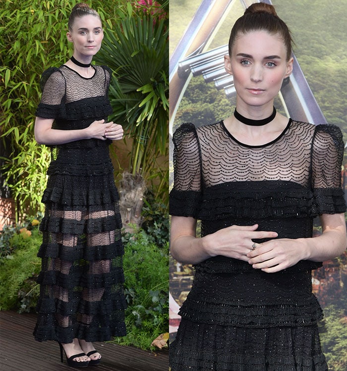 Rooney Mara adjusts the rings on her hands as she poses for photos at the premiere of "Pan"