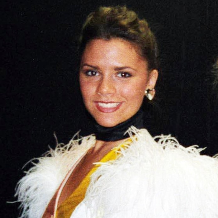 Victoria Beckham smiling in her first stage role, the 1993 production of Bertie