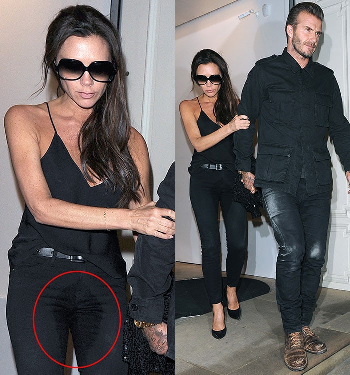 Victoria Beckham clutches onto the arm of her husband, David Beckham, as a large crotch stain is clearly visible on her all-black outfit