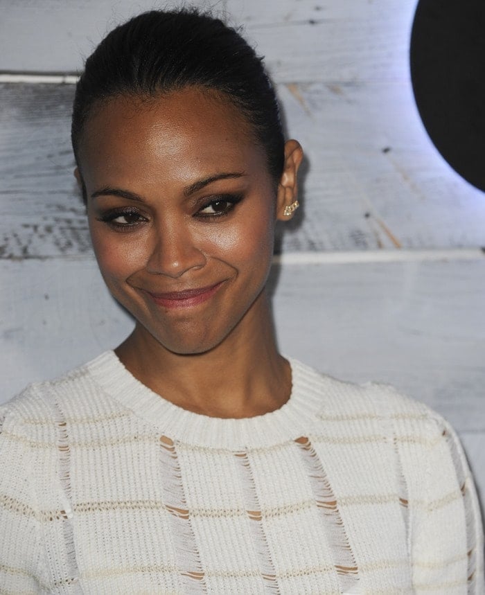 Zoe Saldana gives a sly smile as she attends the launch of Go90 in Beverly Hills