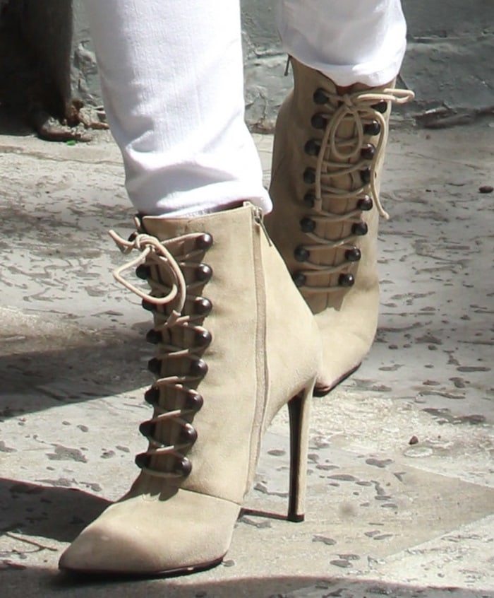 Khloe Kardashian shows off the detailing on her suede Balenciaga heels