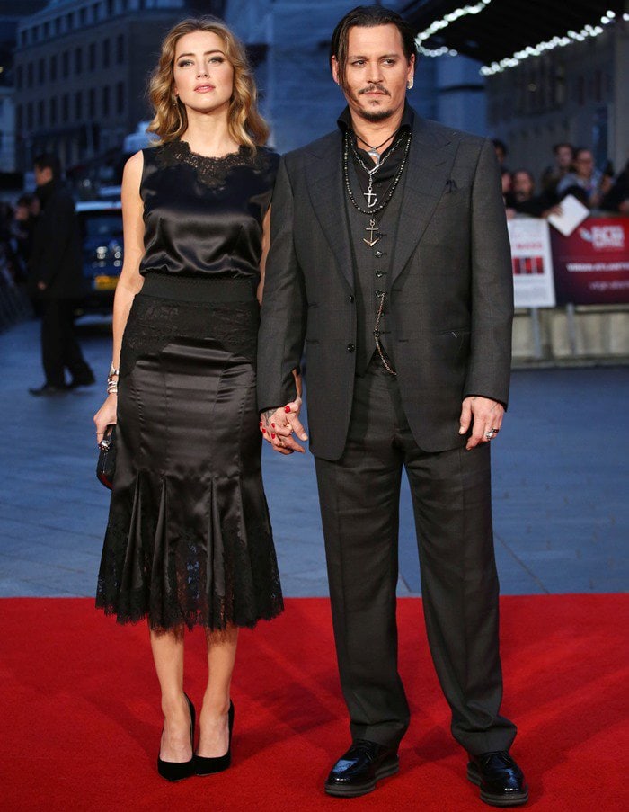 Amber Heard and Johnny Depp hold hands on the red carpet