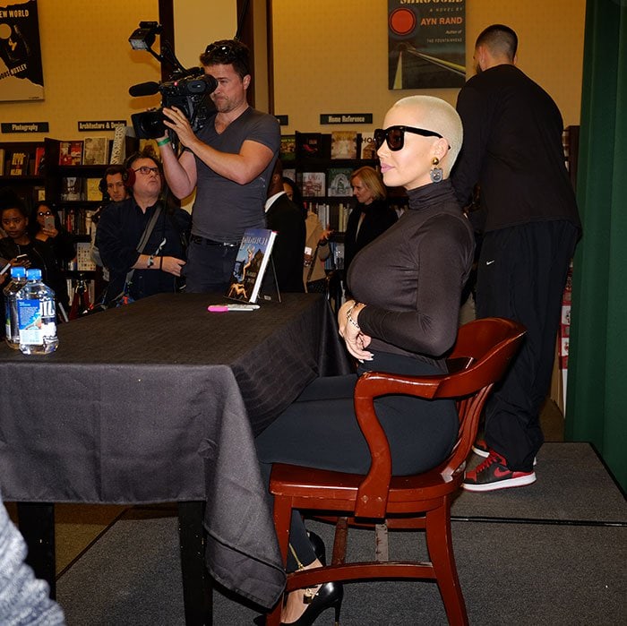 Amber Rose sports her signature shaved hair at her signing of "How to Be a Bad Bitch"