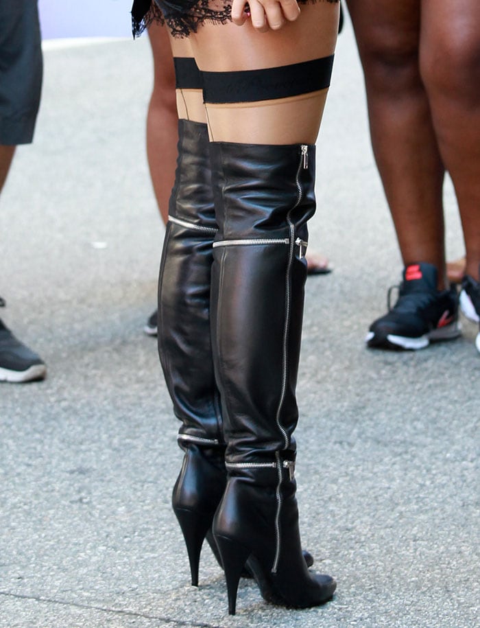 Amber Rose in Saint Laurent thigh-high boots
