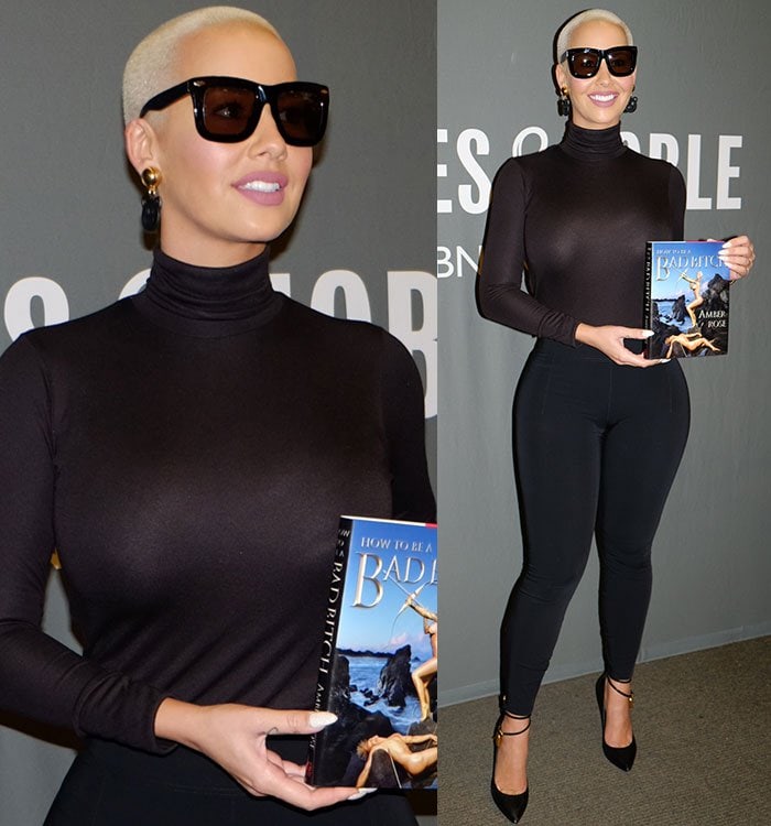 Amber Rose covers her eyes with large black sunglasses