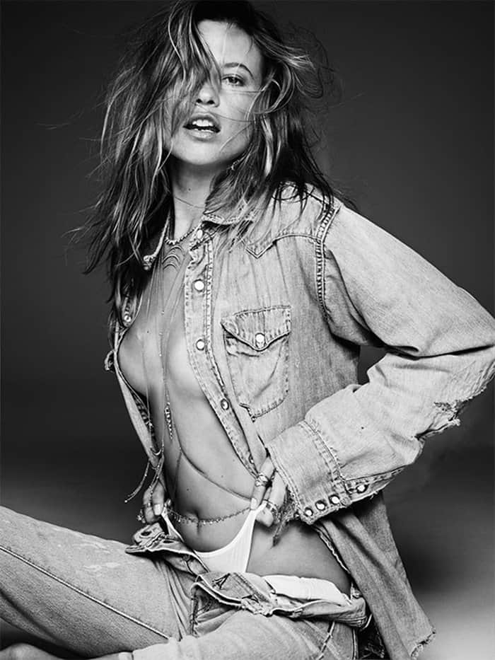 Behati Prinsloo exudes effortless allure in a sultry denim-on-denim look, showcasing Jacquie Aiche’s signature layered jewelry