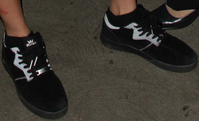 Cara Delevingne's feet in Supra Lucien Clarke x PWBC Quattro sneakers