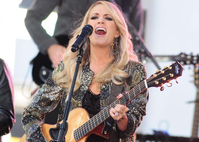 Carrie Underwood wears her long blonde hair down as she performs on the Today show