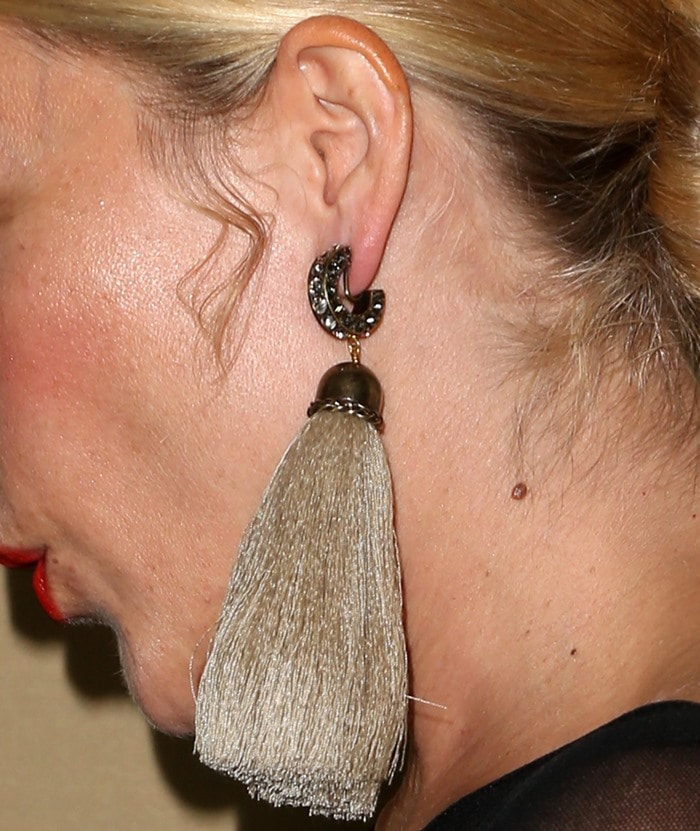 Chloë Sevigny wears her hair back to show off her long tassel earrings from Marina