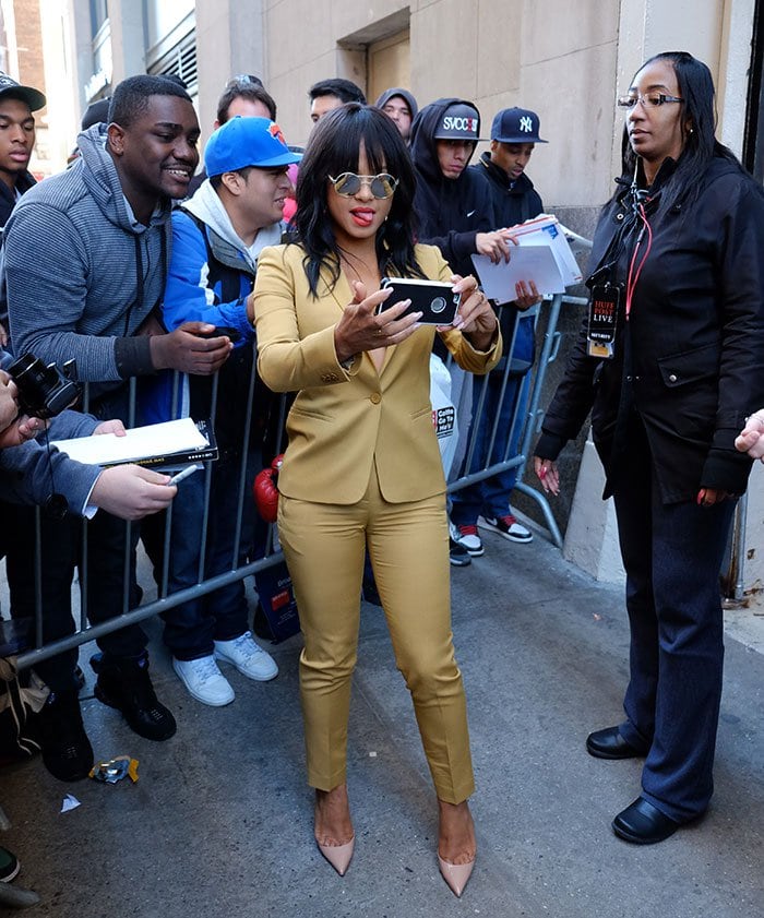 Christina Milian's red lipstick and wavy wig with fringe