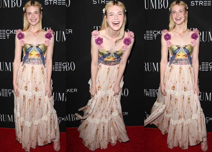 Elle Fanning giggles on the red carpet in a whimsical floral dress from Gucci